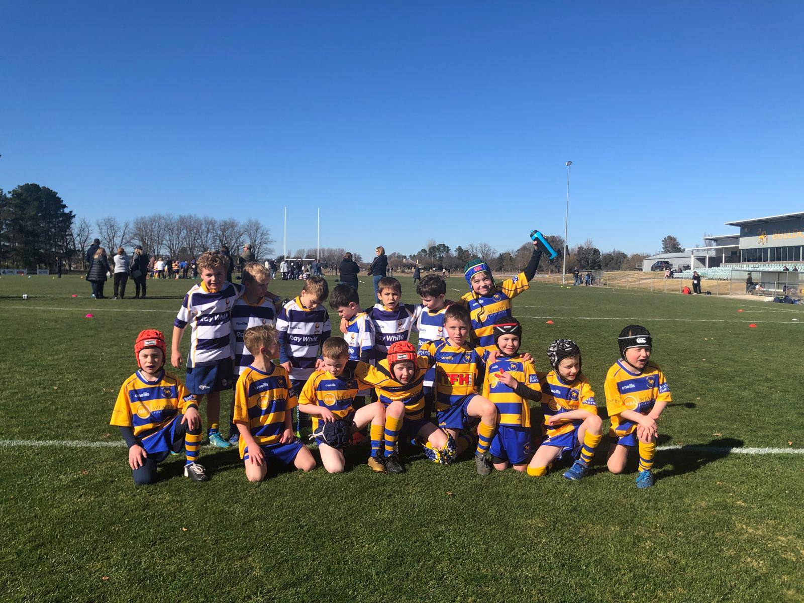Lane Cove under 6 players and country opponents posing together at Bathurst in 2019