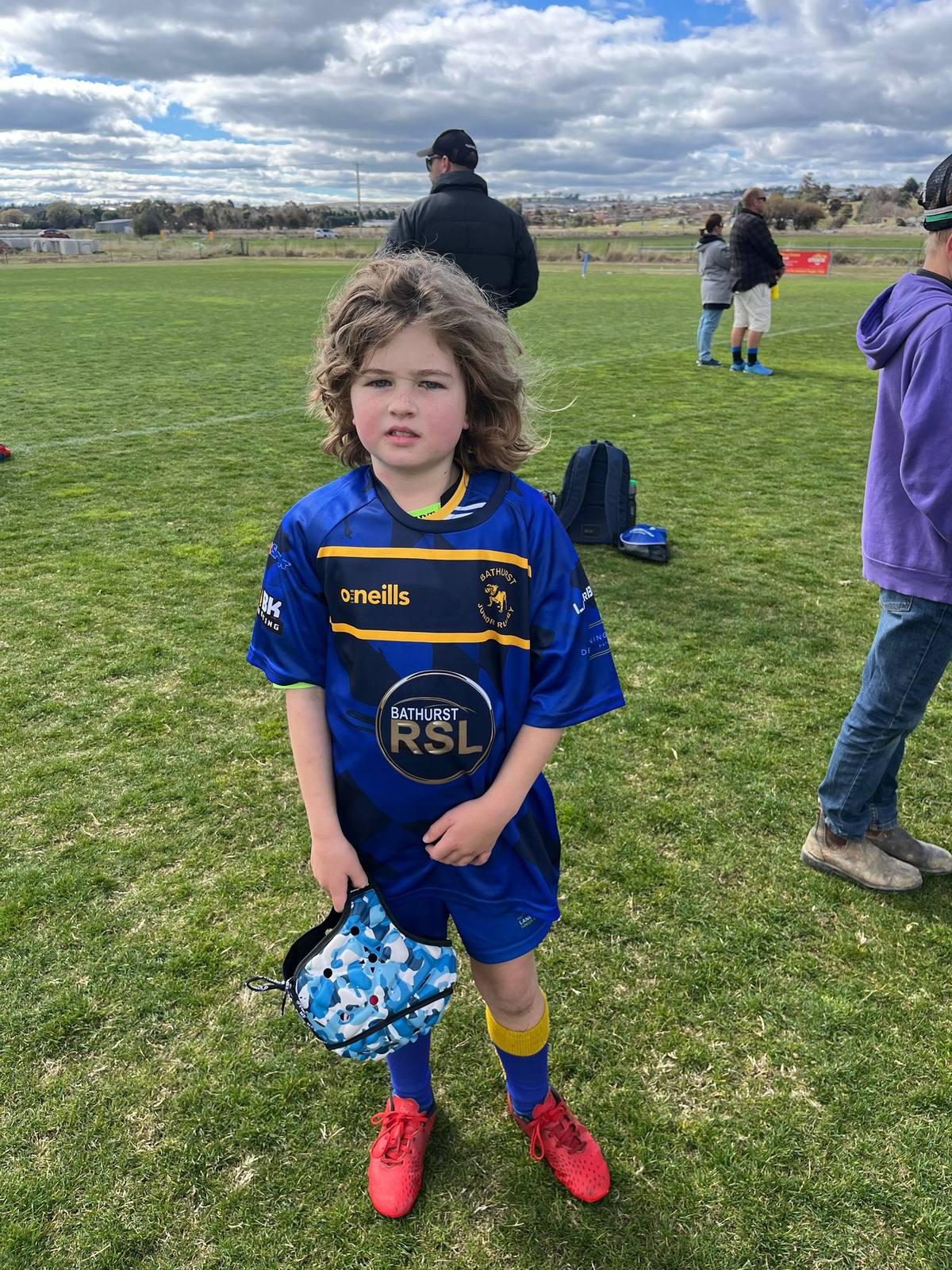 Young player wearing Bathurst colours after a player of the match moment
