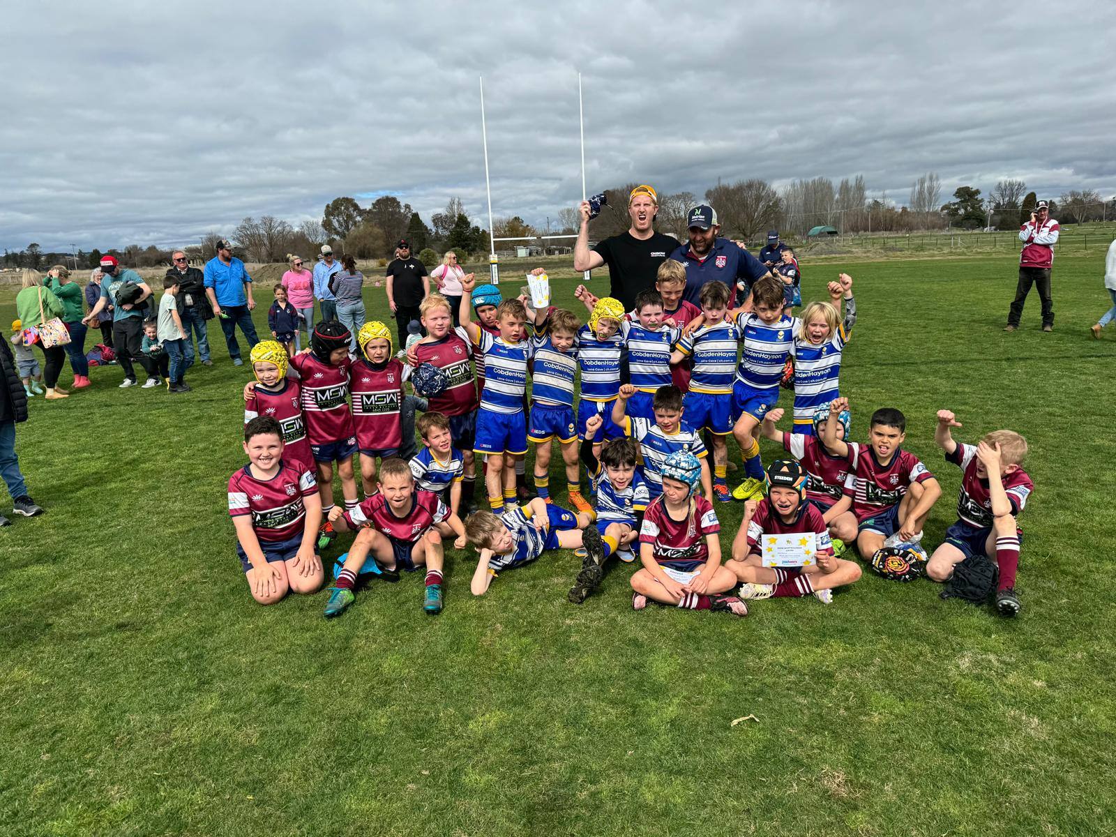 Lane Cove and country Minis players posing together after a Bathurst game in 2024